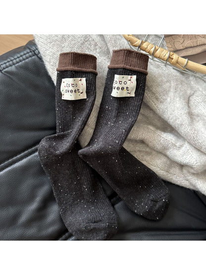 Close-up of toe and heel area of Rufia speckle knit crew sock