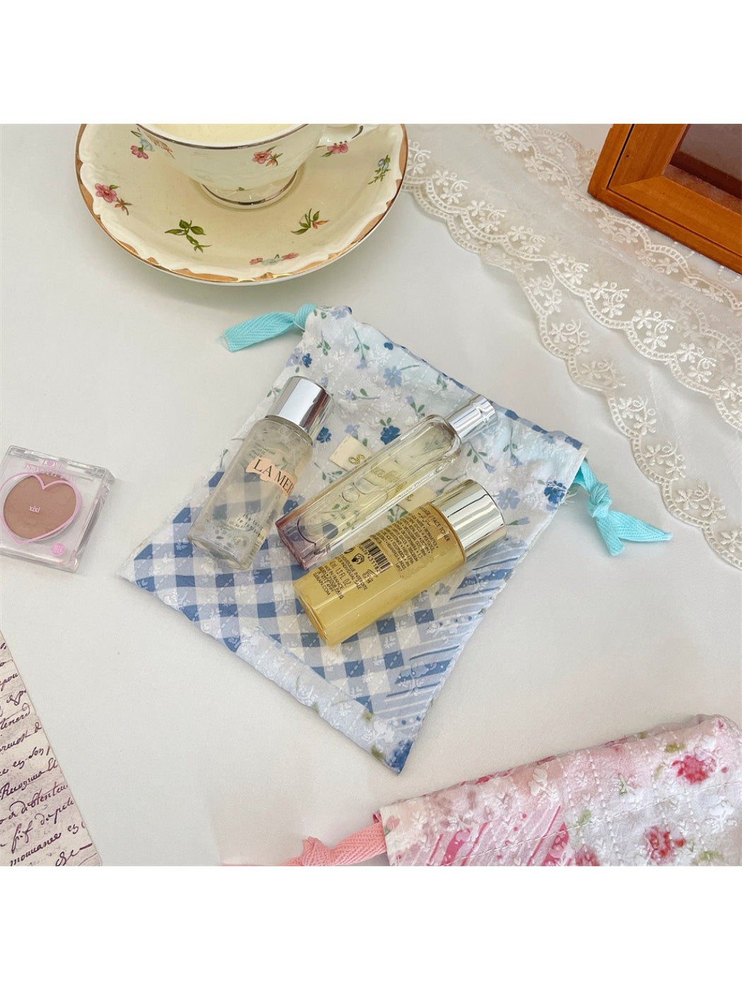 Cosbai drawstring pouch displayed flat to show full floral patchwork pattern