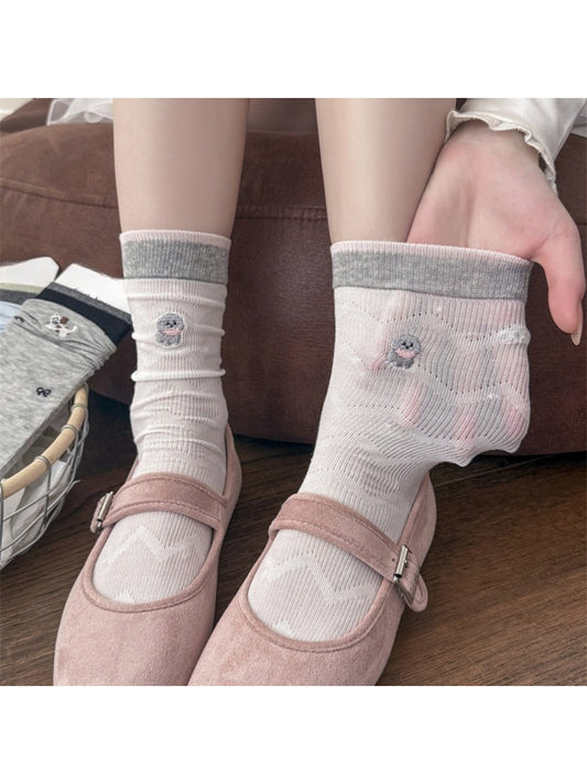 Close-up of Rufia low cut socks showing detailed dog embroidery on mesh fabric
