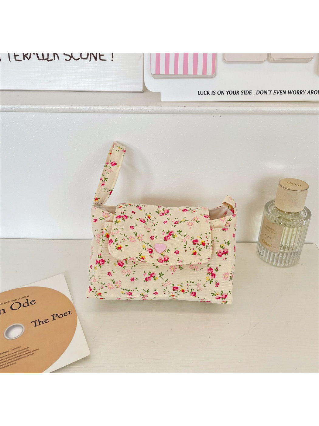 Cosbai Mini Handle Bag held in hand to show size and scale