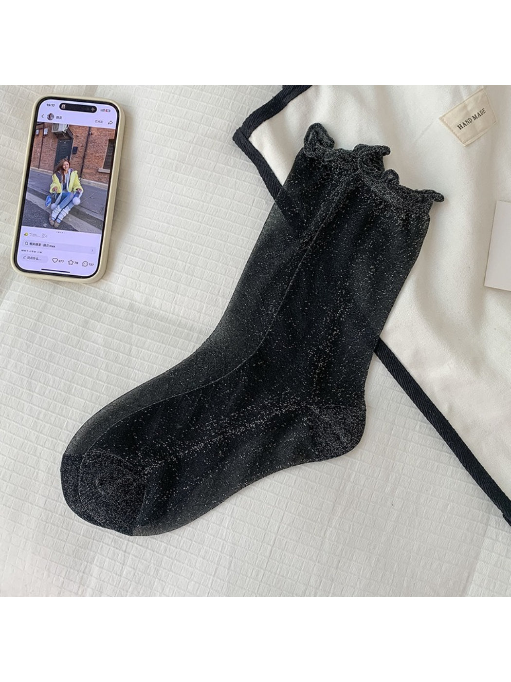 Stack of Rufia everyday crew socks in various neutral colors with sparkle