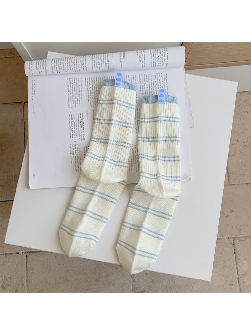 Rufia socks folded to show the contrast stripe design on the cuff