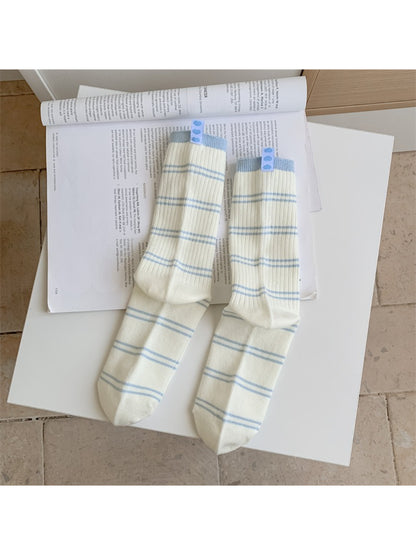 Rufia socks folded to show the contrast stripe design on the cuff