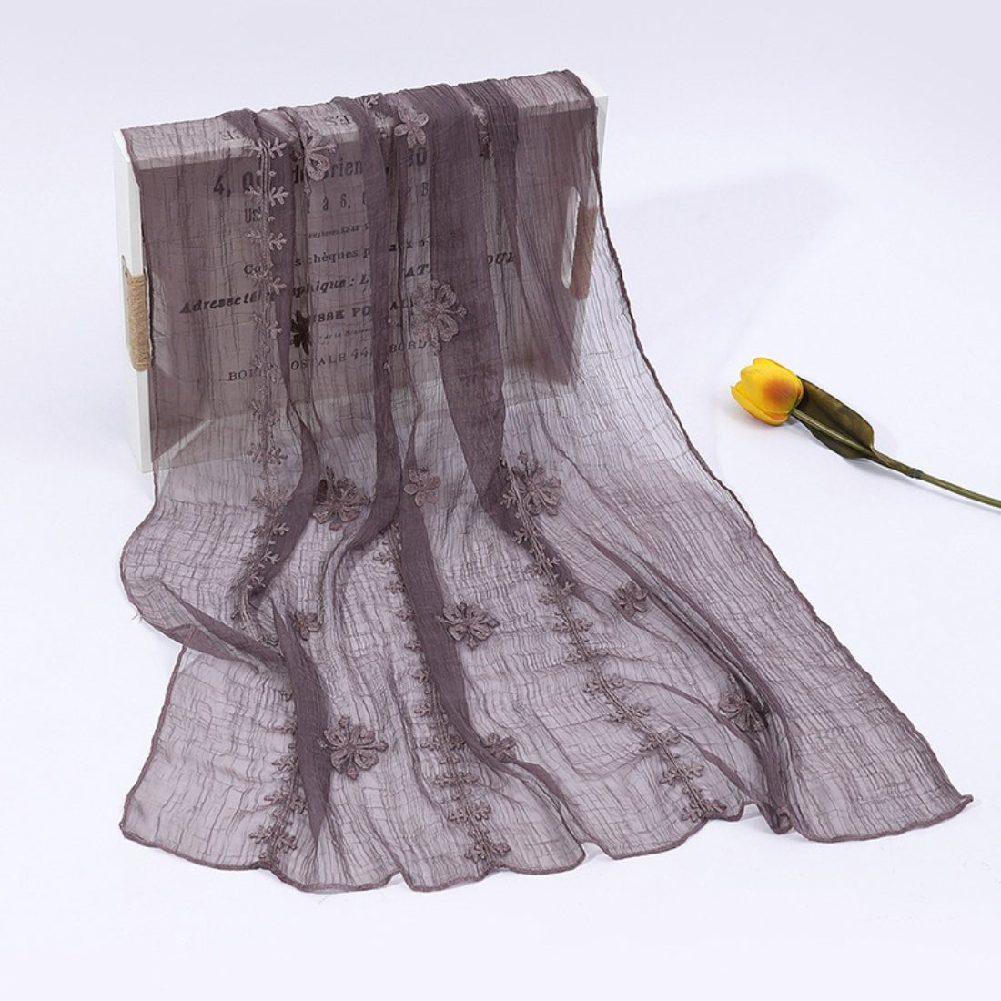 Scarvii scarf hanging to display full length and delicate blossom stitch work