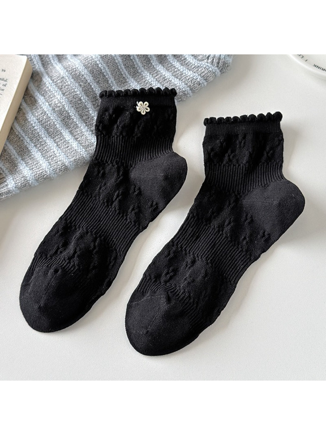 Pair of Rufia Sweet Floral Knit Crew Socks folded neatly