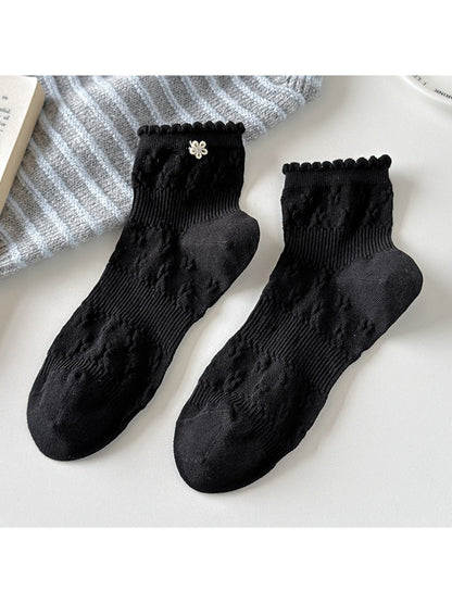 Pair of Rufia Sweet Floral Knit Crew Socks folded neatly
