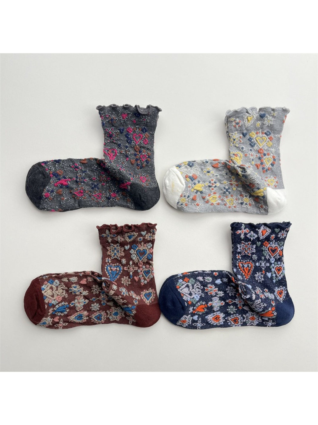 Rufia Heart White Mid-Calf Socks laid flat showing full length and heart pattern