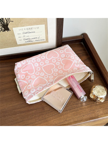 Cosbai makeup bag partially open, revealing pink interior