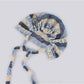 Side view of Haila hollow out lace up knit slouchy beanie highlighting slouchy fit and lace-up design