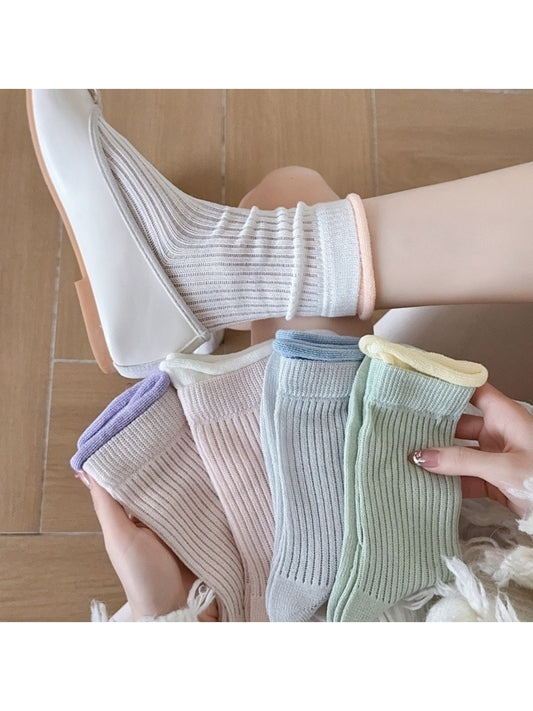 Pair of Rufia ribbed crew socks with pastel pink contrast trim on white background