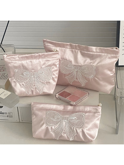 Close-up of the bow detail on the Cosbai elegant cosmetic pouch