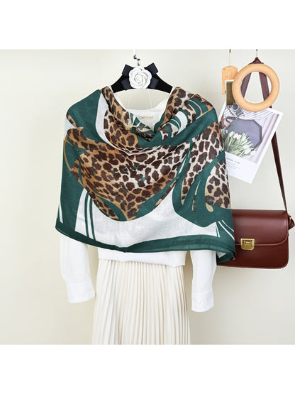 Close-up of Scarvii scarf fabric with detailed leopard and flower pattern