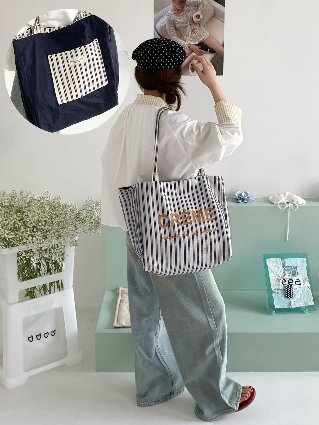 Model carrying Cosbai reversible striped tote bag over shoulder