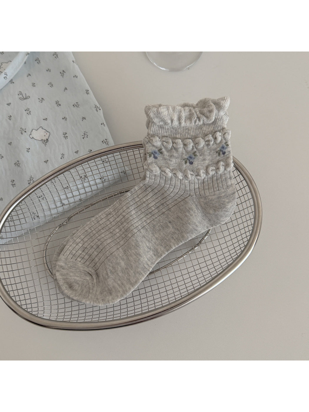 Rufia floral detail ribbed crew socks paired with light-colored outfit
