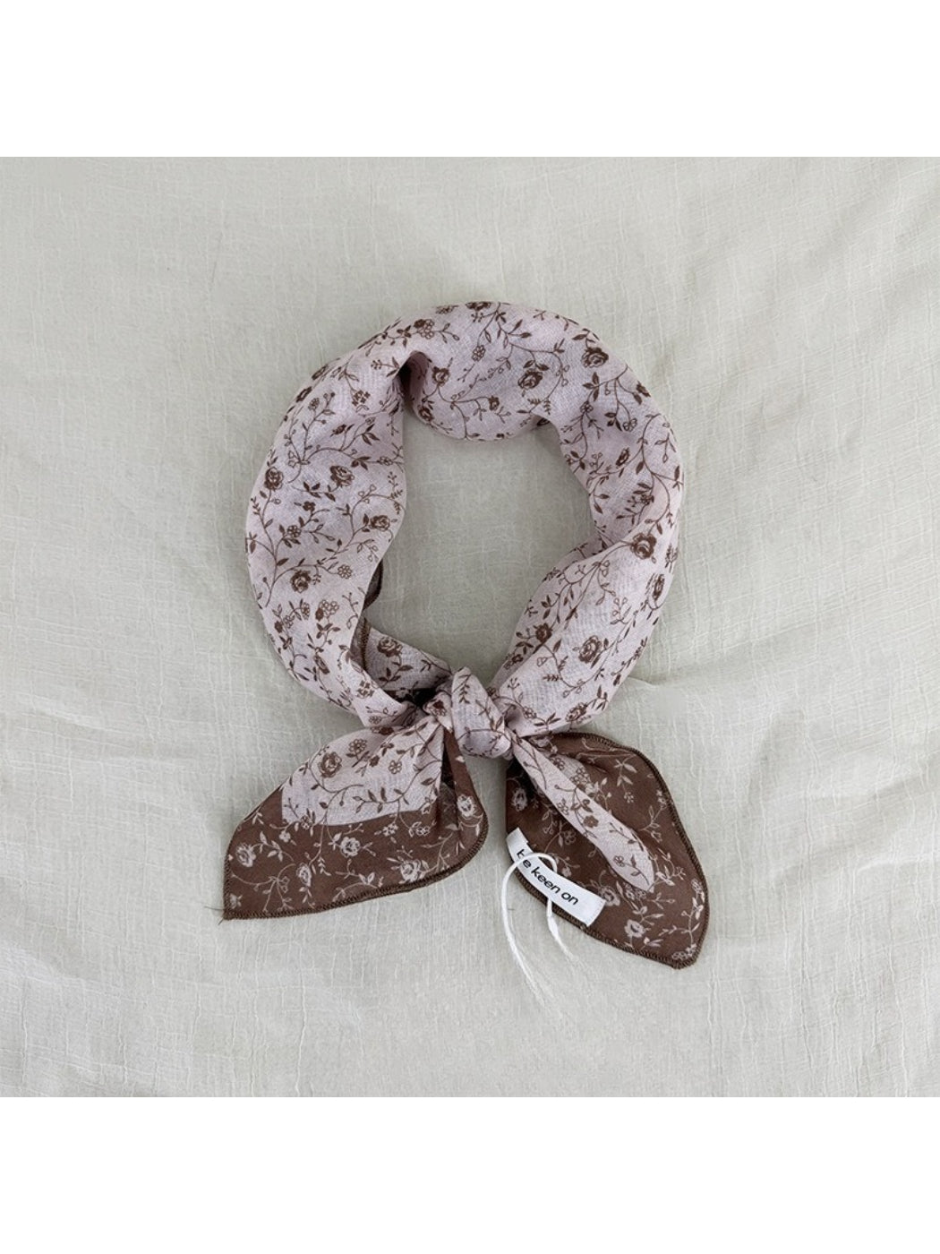 Close-up of Scarvii Vintage Botanical square scarf corner with detailed botanical illustrations