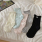 Rufia mesh dot mid-calf socks displayed flat showing sheer fabric with dot pattern