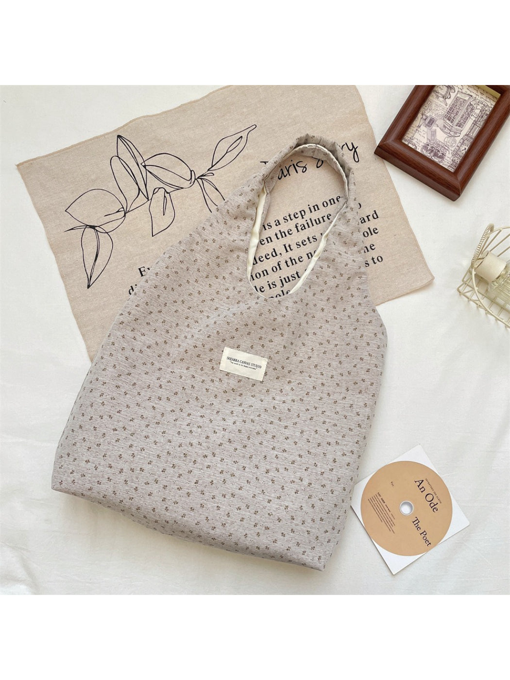 Close-up of floral print and fabric texture on Cosbai Tiny Floral Slouch Tote Bag