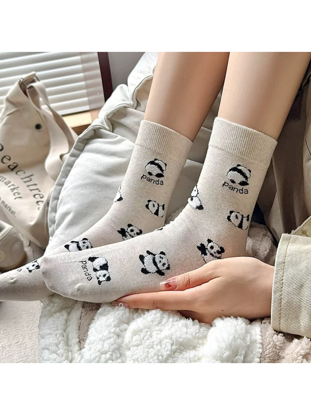 Close-up of panda face detail on Rufia Playful Panda crew socks
