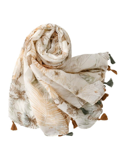 Flat lay of Scarvii Tropical Floral Tassel Scarf fully spread showing full floral design