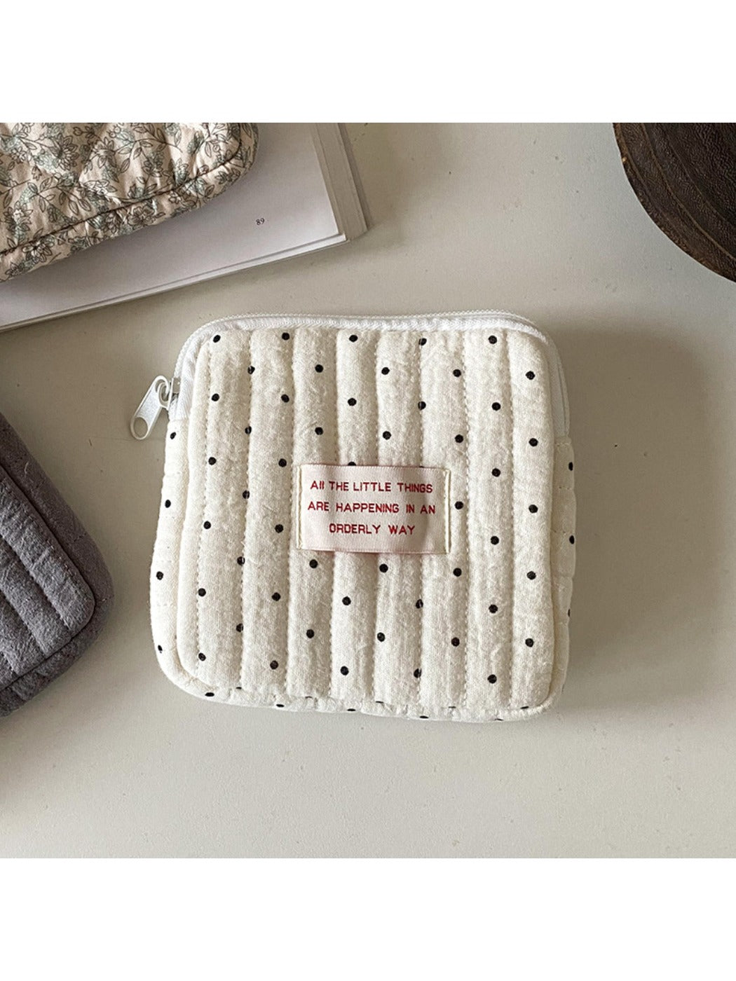 Cosbai cartoon print mini storage pouch photographed with natural lighting