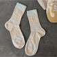Side view of Rufia heart socks showing heel and toe colourblock details