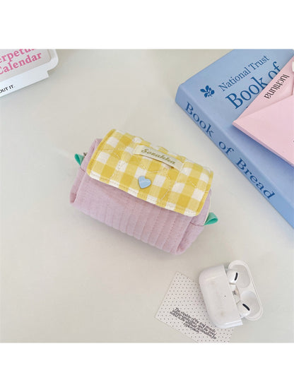 Side view of Cosbai gingham quilted cosmetic pouch highlighting thickness