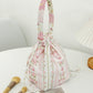 Cosbai soft floral drawstring handbag laying flat showing overall floral pattern