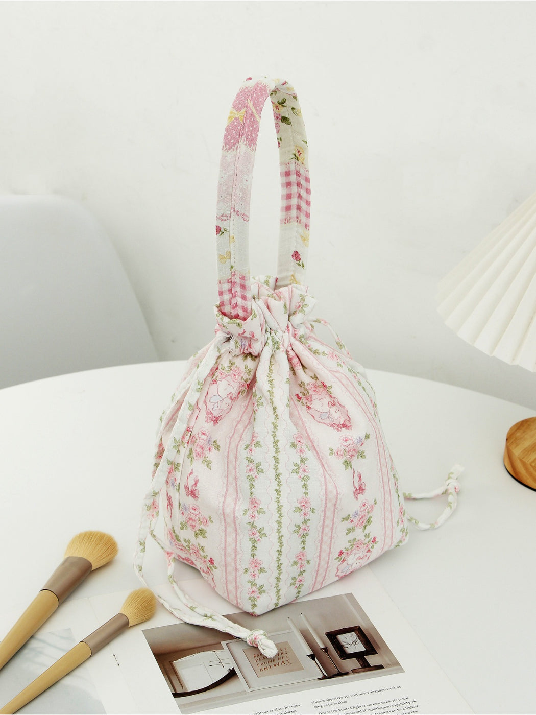 Cosbai soft floral drawstring handbag laying flat showing overall floral pattern