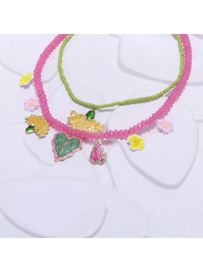 Neckit Summer Fruit Necklace laid flat highlighting the arrangement of fruit and floral charms
