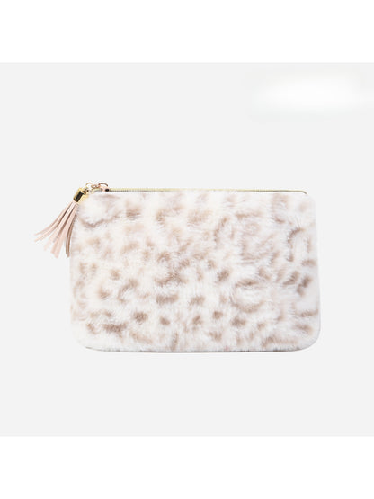 Close-up of Cosbai plush leopard tassel makeup bag showing texture and pattern