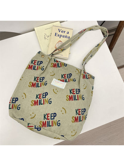 Cosbai Keep Smiling Corduroy Tote Bag displayed flat with handles extended