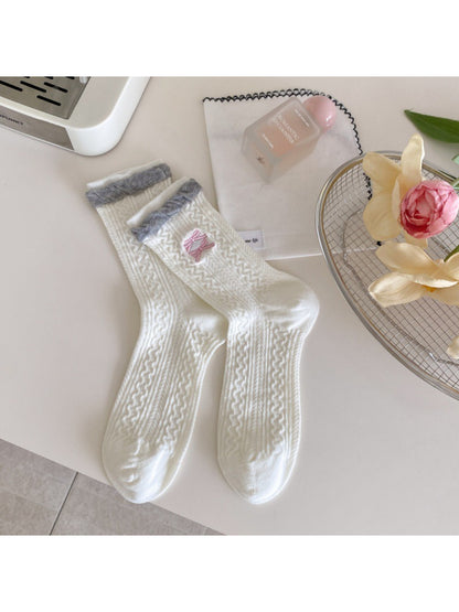Side view of Rufia Romantic Everyday Crew Socks on a model's feet