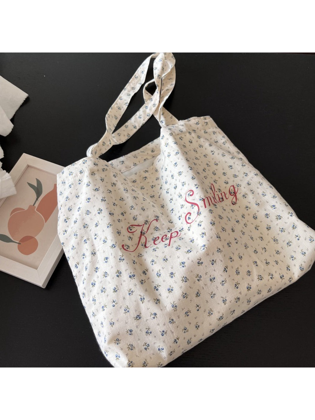 Side view of Cosbai vintage floral tote bag highlighting sturdy handles and fabric texture