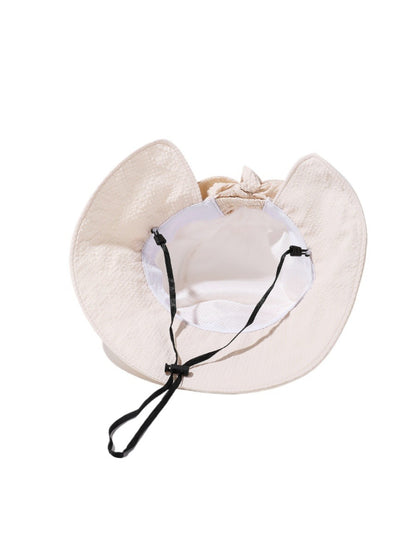 Back view of Haila summer hat highlighting tied strap and brim shape