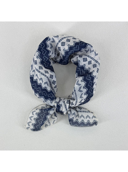 Scarvii geometric pattern square scarf folded showing blue and beige design