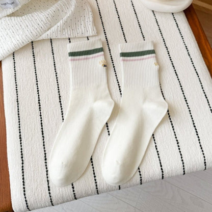 Top view of Rufia Retro Stripe Letter Crew Socks showing the letter detail on the cuff