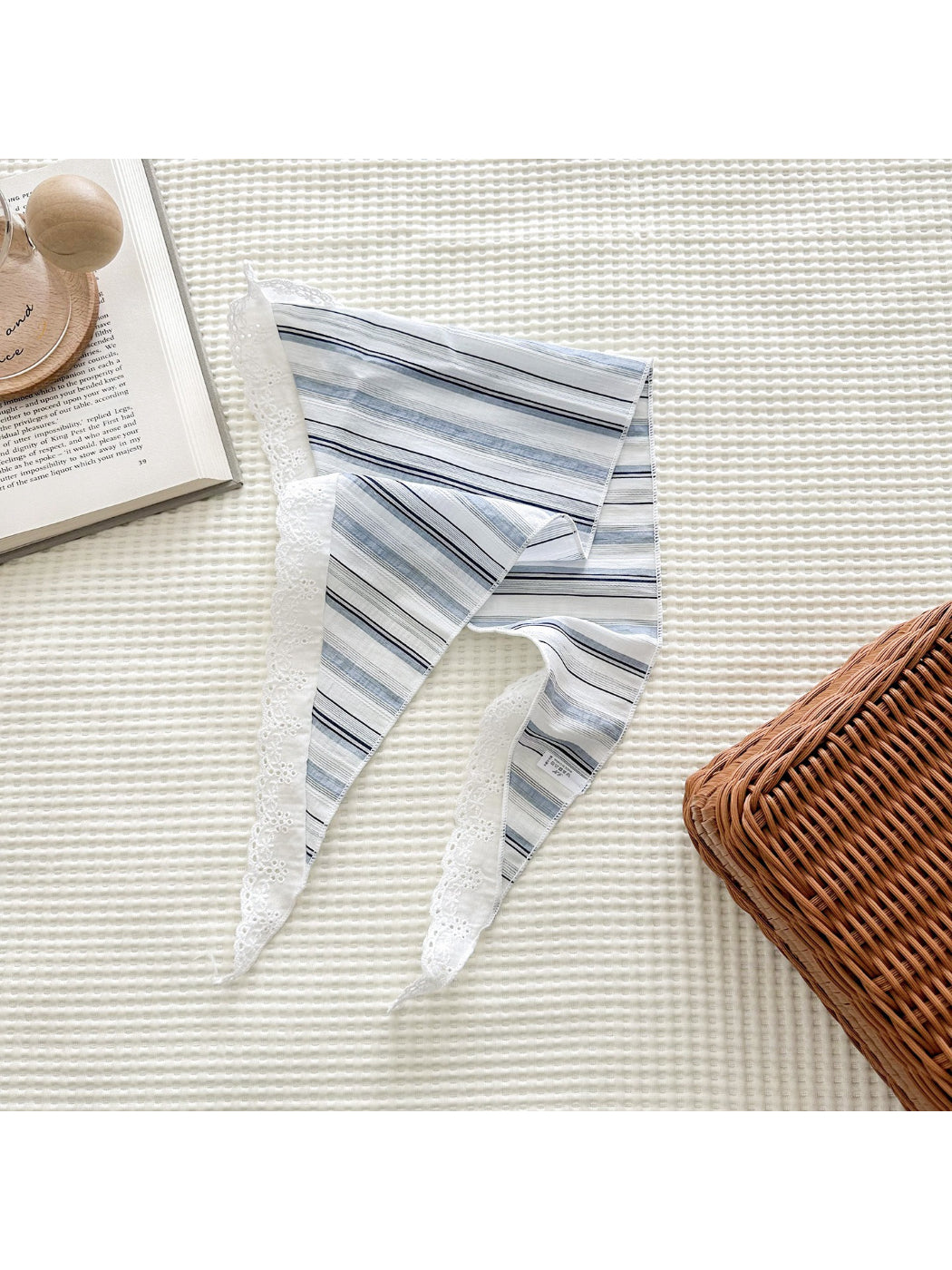 Close-up of Scarvii scarf showing delicate lace trim and stripe details
