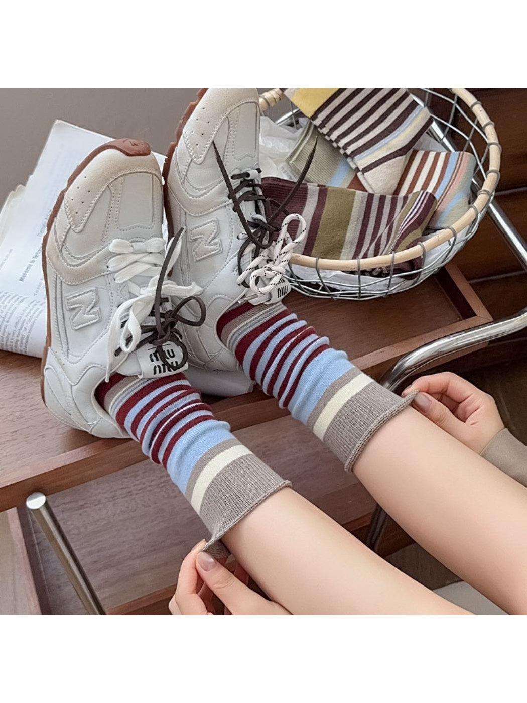 Close-up of Rufia socks showing detailed bow pattern and colorblock design