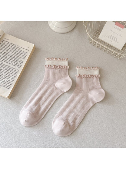 Close-up of ribbed knit pattern on Rufia Sweet Frill Edge Ribbed Socks in cream color
