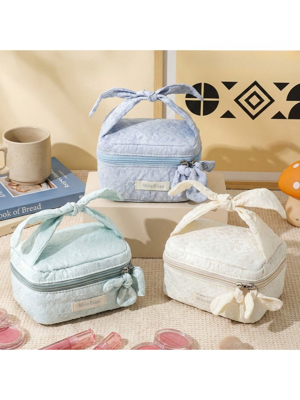 Cosbai Bow Top Handle Makeup Case in a closed position with a bow detail on top