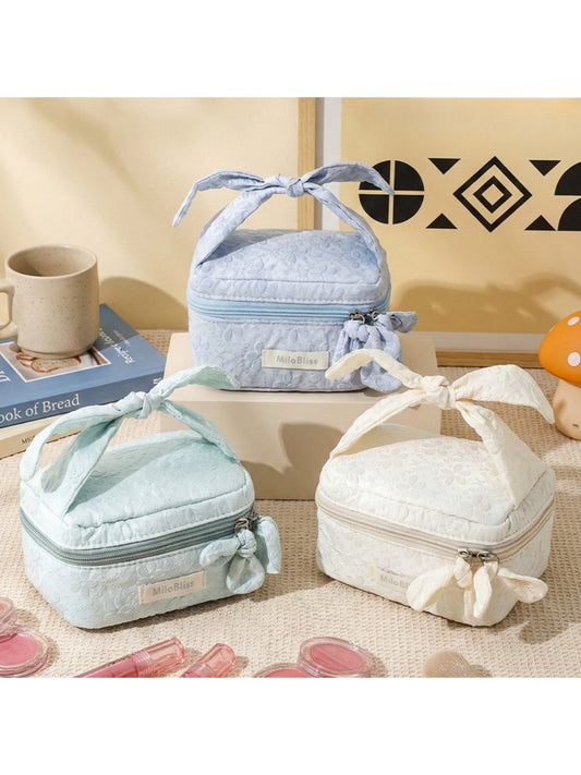 Cosbai Bow Top Handle Makeup Case in a closed position with a bow detail on top
