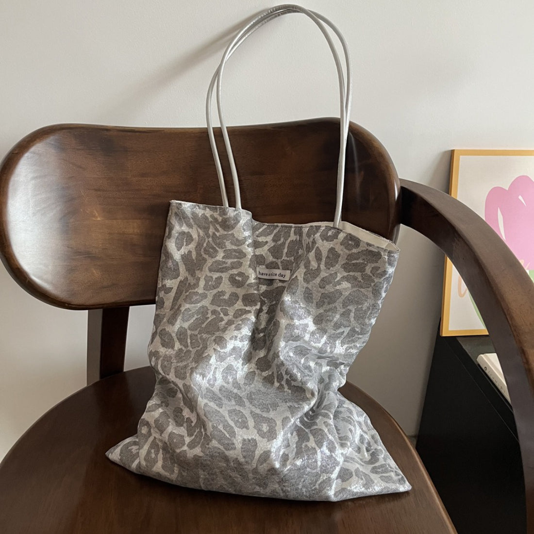 Top view of grey leopard print tote bag with open interior