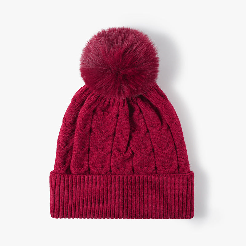 Red plush lined cable knit pom beanie