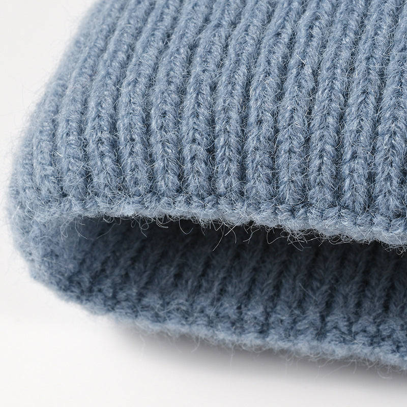 Gray colorblock plush lined pom knit beanie detail