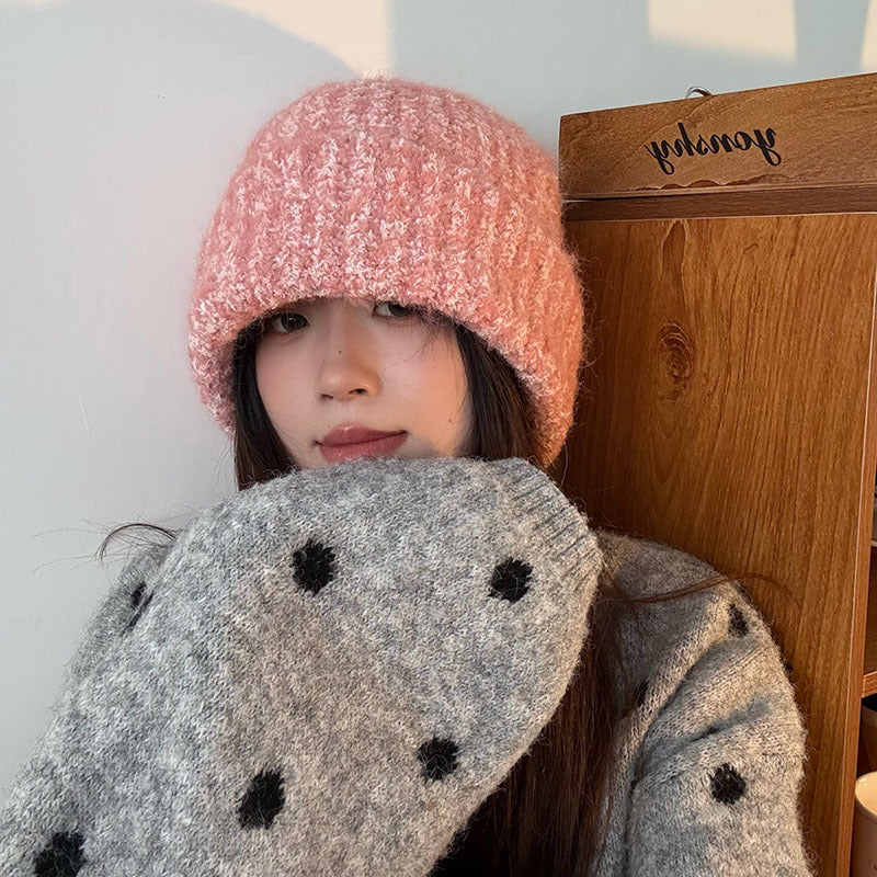Pink textured fleck knit beanie worn by a model