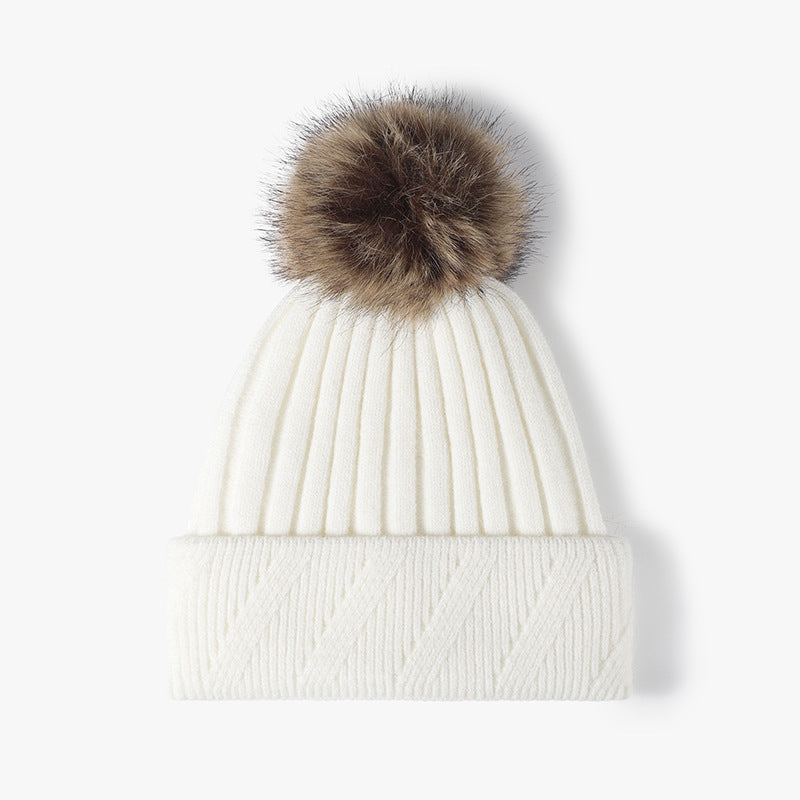 White faux fur-lined pom-pom textured knit beanie product view