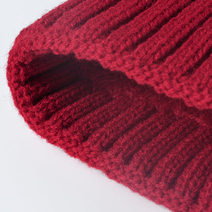 Burgundy cable knit pom-pom cuffed beanie product view