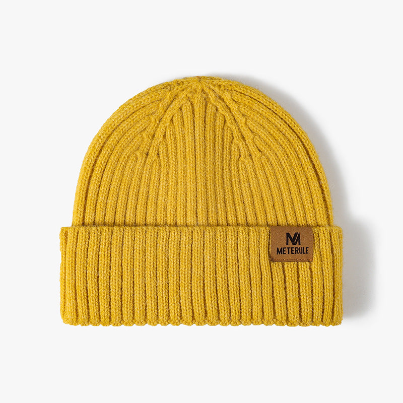 Yellow label patch ribbed knit beanie