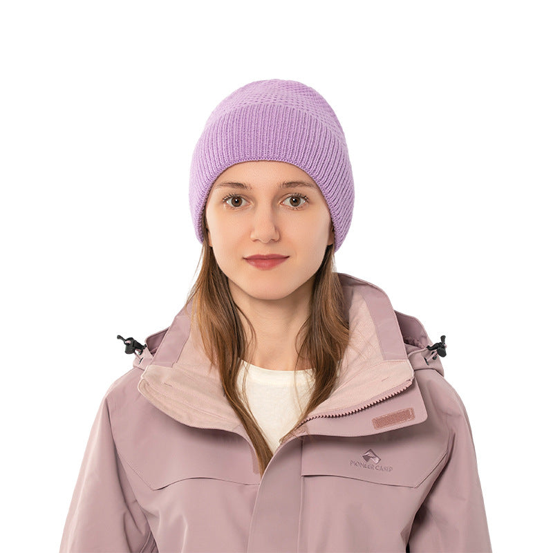 Purple ribbed cuff knit beanie front view on a model
