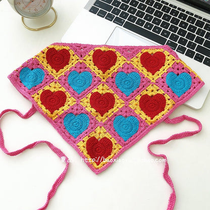 Scarvii crochet heart hairband displayed with soft lighting on a neutral background